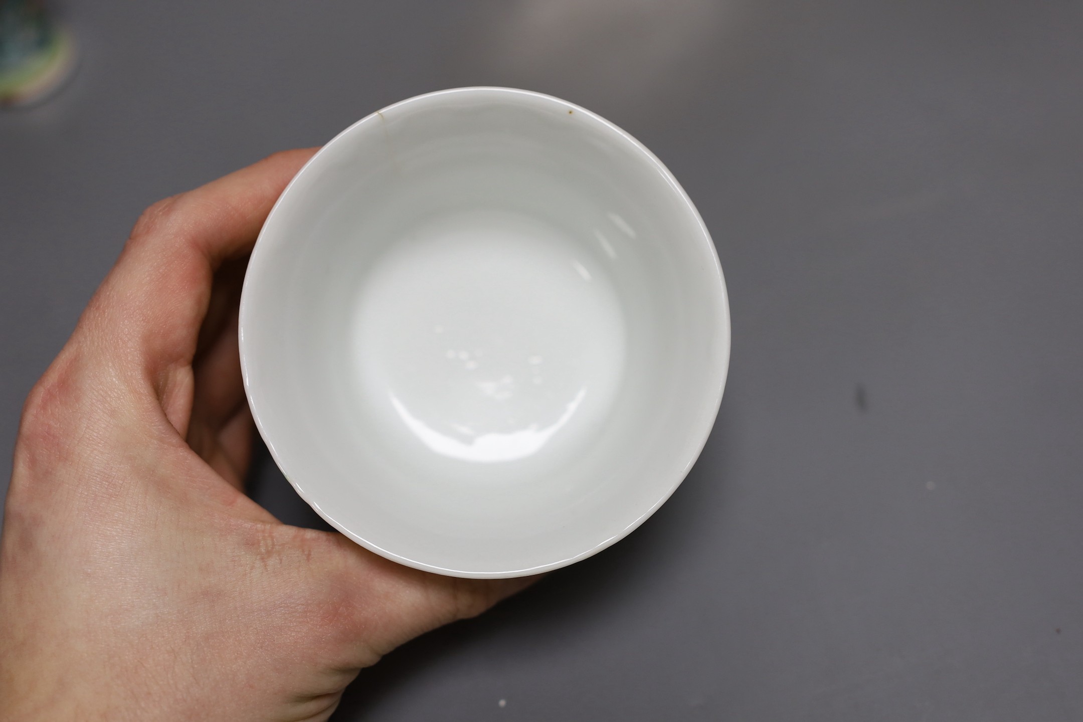 A Chinese famille rose tea bowl, similar small vase and a London shape coffee cup and saucer